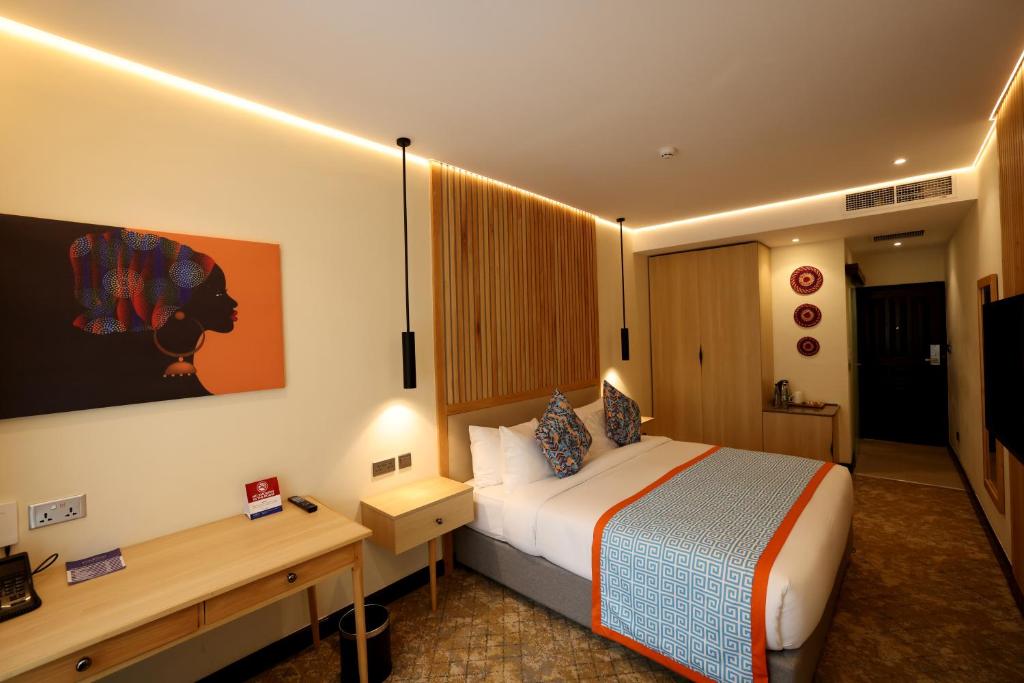 Postel nebo postele na pokoji v ubytování PrideInn Westlands Luxury Boutique Hotel