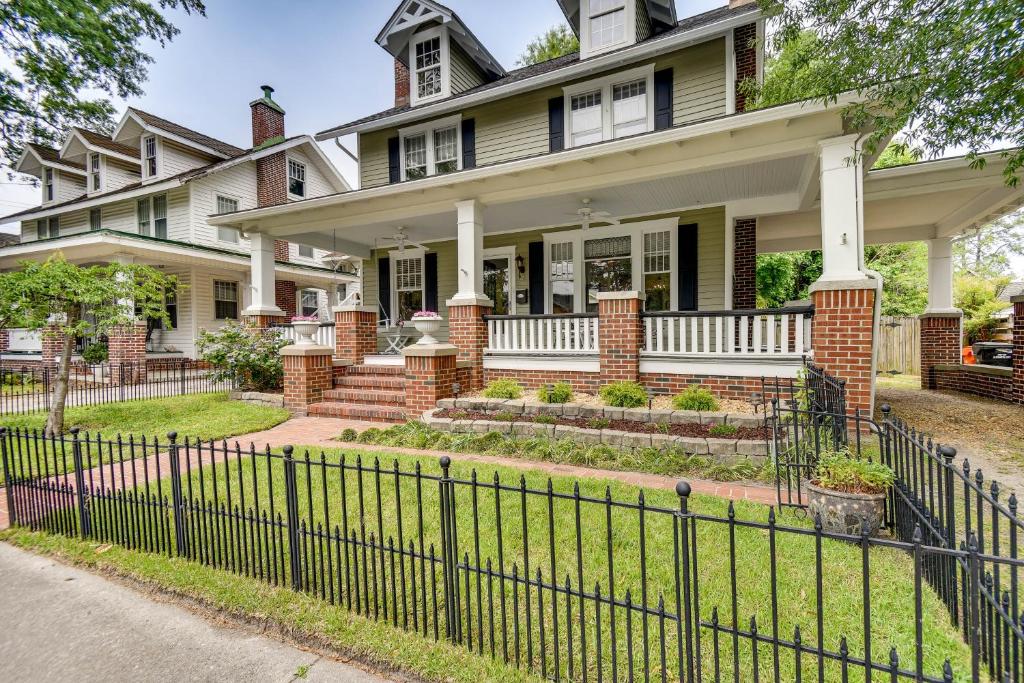 a house with a fence in front of it at Elizabeth City Vacation Rental Gazebo with Hot Tub! in Elizabeth City