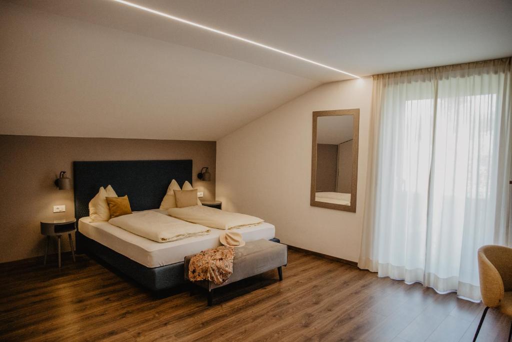 Postel nebo postele na pokoji v ubytování Feldgärtenhof
