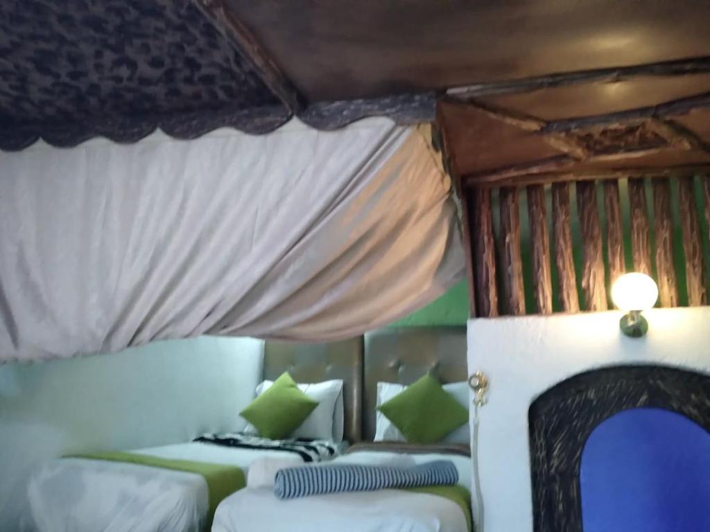 Una cama o camas en una habitación de Riad Antek