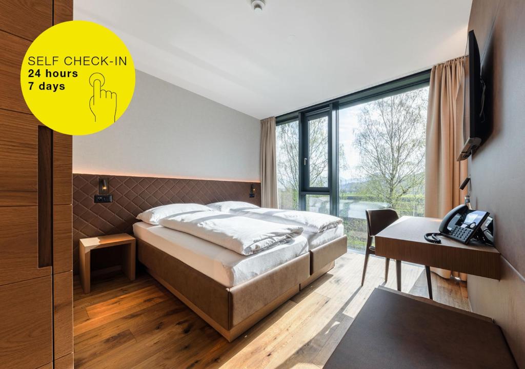 Postel nebo postele na pokoji v ubytování Hotel kommod