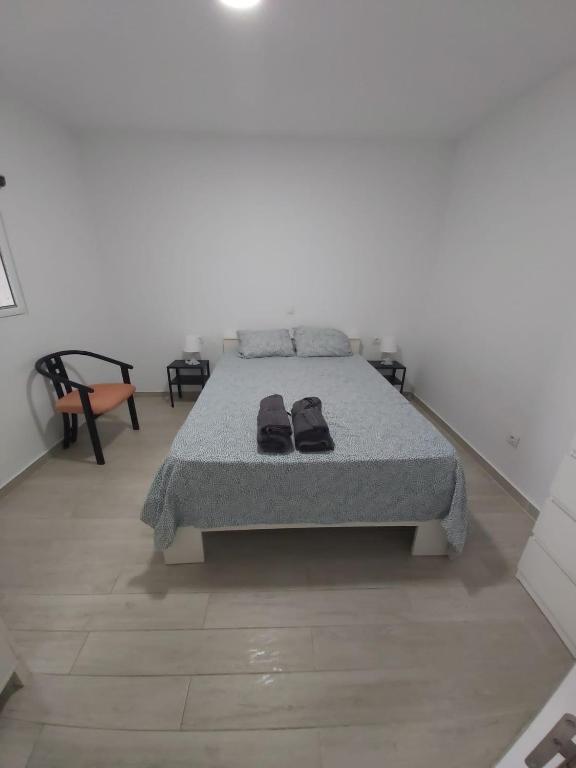 Posteľ alebo postele v izbe v ubytovaní BeachFront House