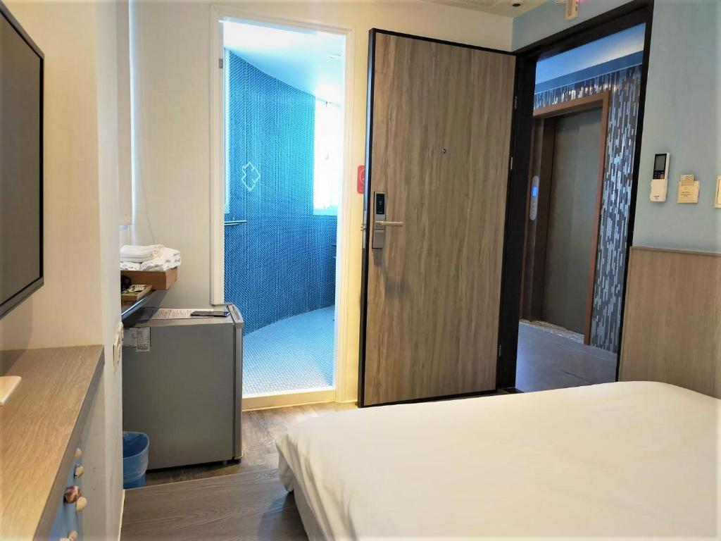 Postel nebo postele na pokoji v ubytování 棉花雲文旅民宿B&B
