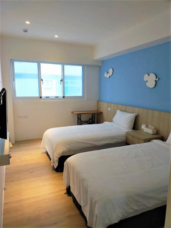 Postel nebo postele na pokoji v ubytování 棉花雲文旅民宿B&B