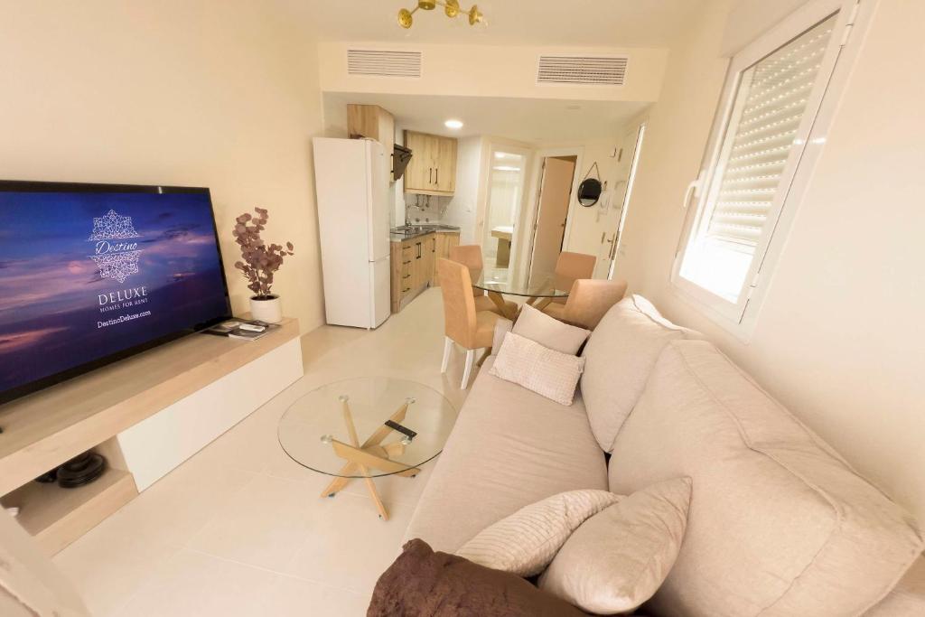 Televízia a/alebo spoločenská miestnosť v ubytovaní Destino Deluxe Vera Playa - Laguna Beach
