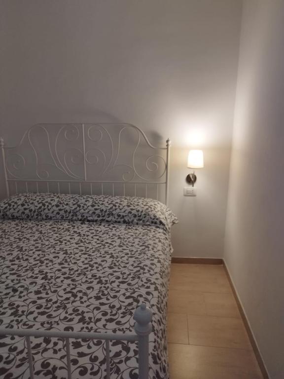 Postel nebo postele na pokoji v ubytování A Suata