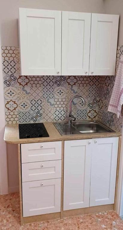 Kuchyň nebo kuchyňský kout v ubytování Tagghiate House