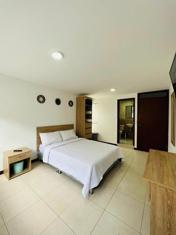 Postel nebo postele na pokoji v ubytování Hostelfc San Luis