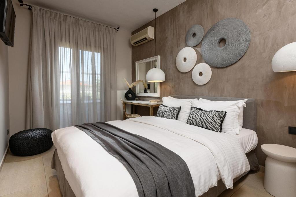 Ένα ή περισσότερα κρεβάτια σε δωμάτιο στο Nikoleta Luxury Villa