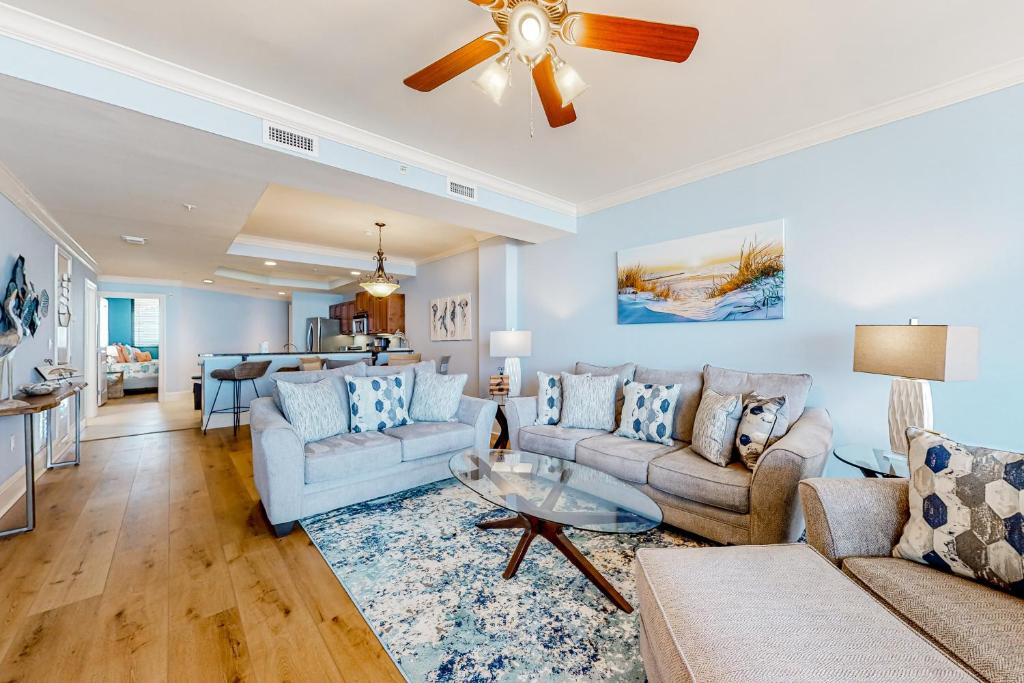 a living room with a couch and a table at Holiday Isle 715 in Dauphin Island