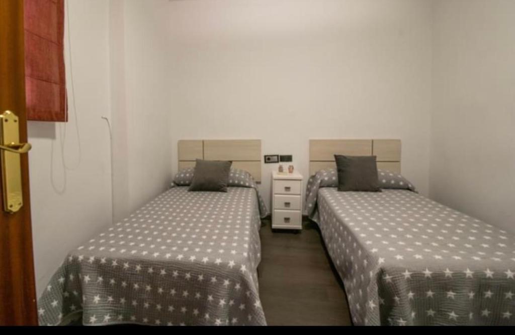 Postel nebo postele na pokoji v ubytování Vivienda con Fines Turísticos Salvador
