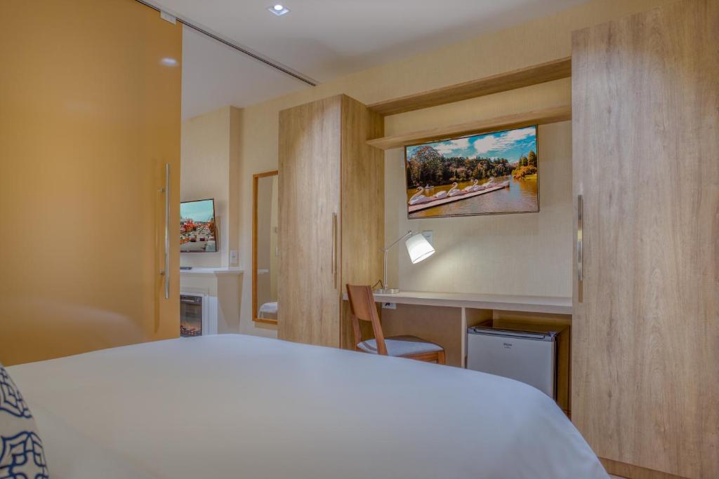 Postel nebo postele na pokoji v ubytování Wyndham Gramado Termas Resort & Spa