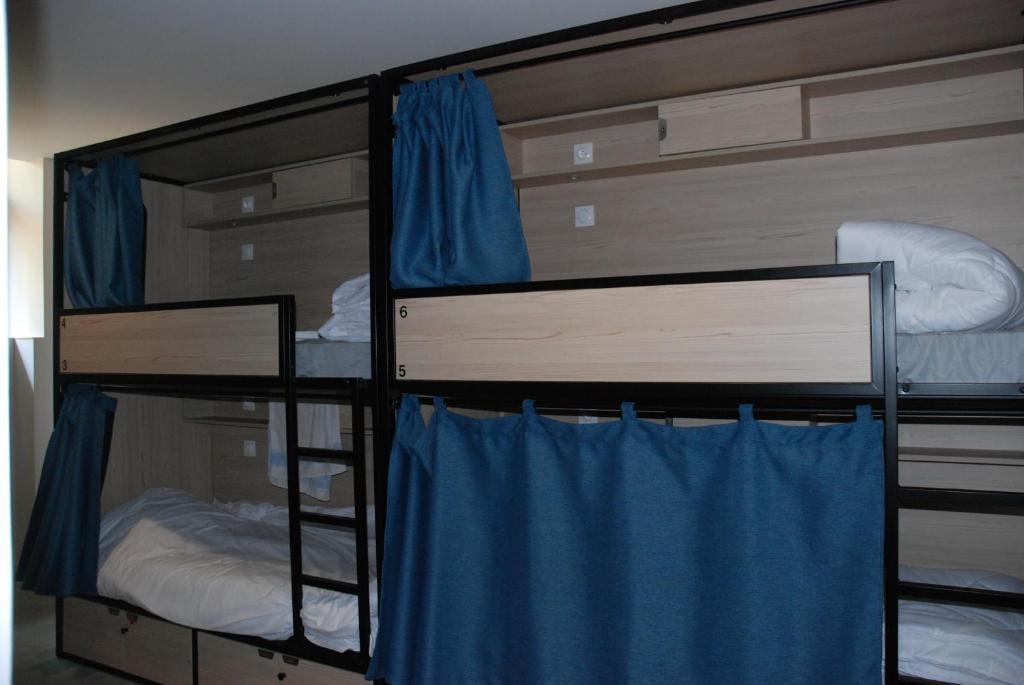 Un ou plusieurs lits dans un hébergement de l'établissement YASI Hostel