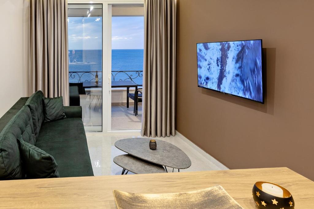 TV a/nebo společenská místnost v ubytování Apartments Piano