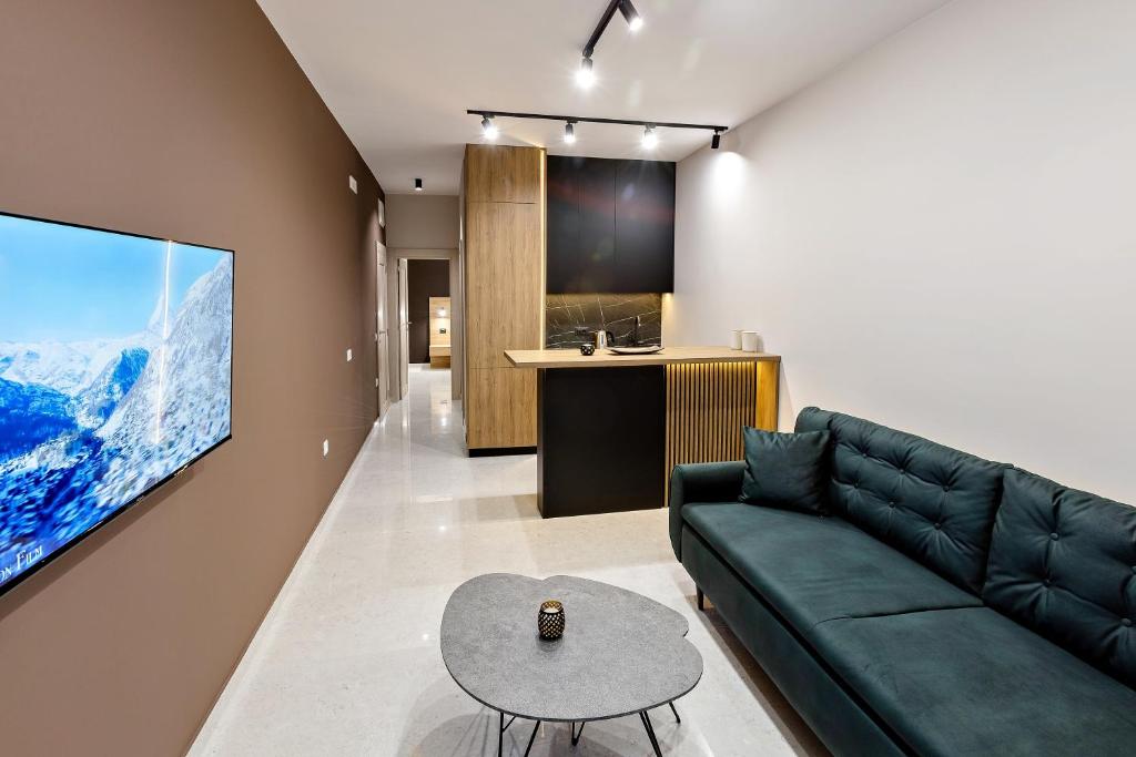 TV a/nebo společenská místnost v ubytování Apartments Piano