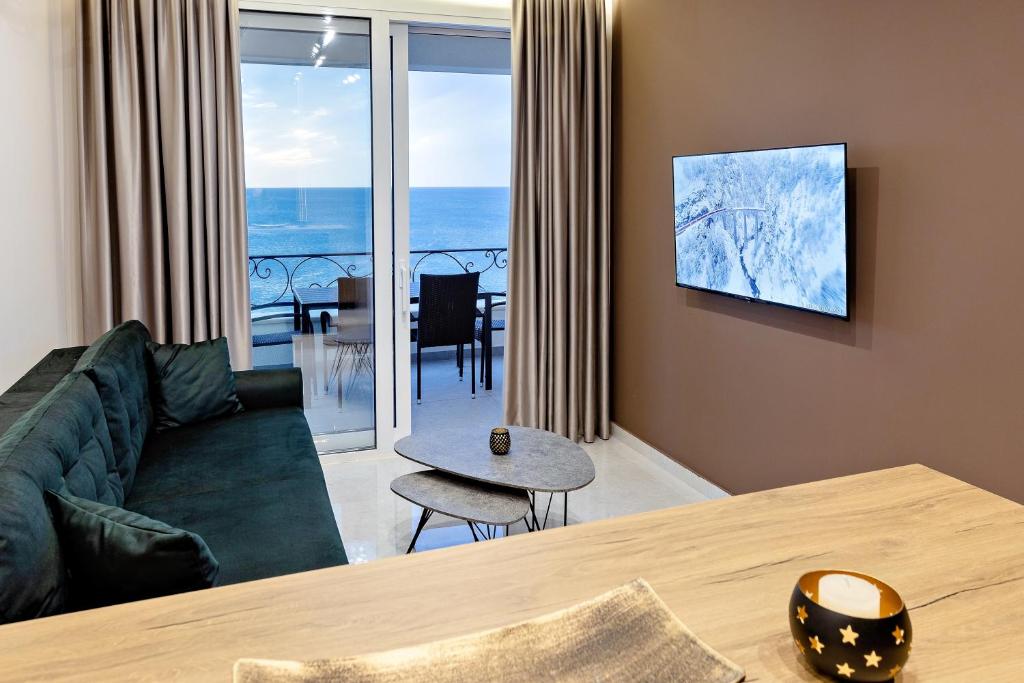 TV a/nebo společenská místnost v ubytování Apartments Piano