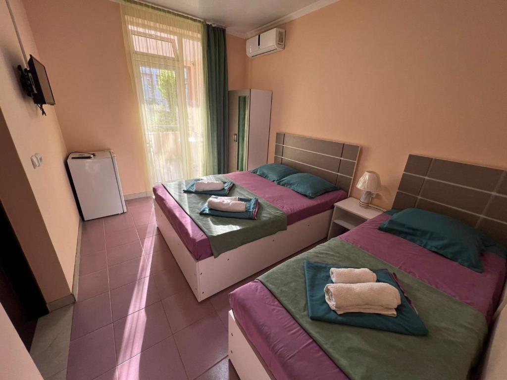 Postel nebo postele na pokoji v ubytování Imeri Hotel