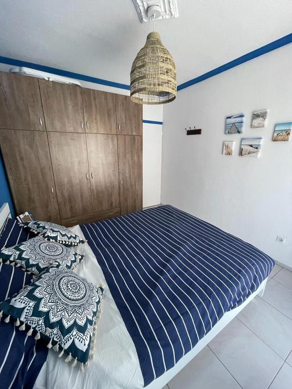 Postel nebo postele na pokoji v ubytování Blue Shell Apartment