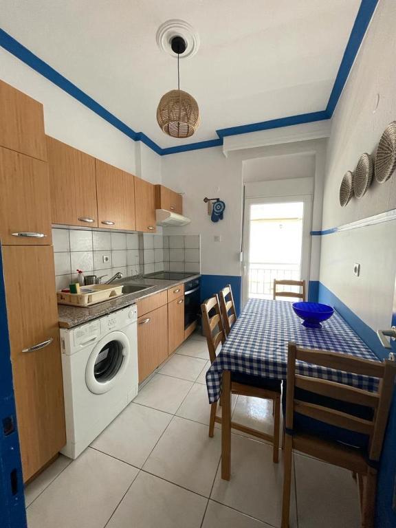 Kuchyň nebo kuchyňský kout v ubytování Blue Shell Apartment