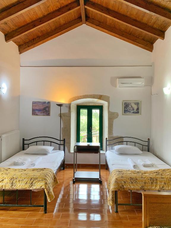 Postel nebo postele na pokoji v ubytování Evaggelias Home Gavalochori