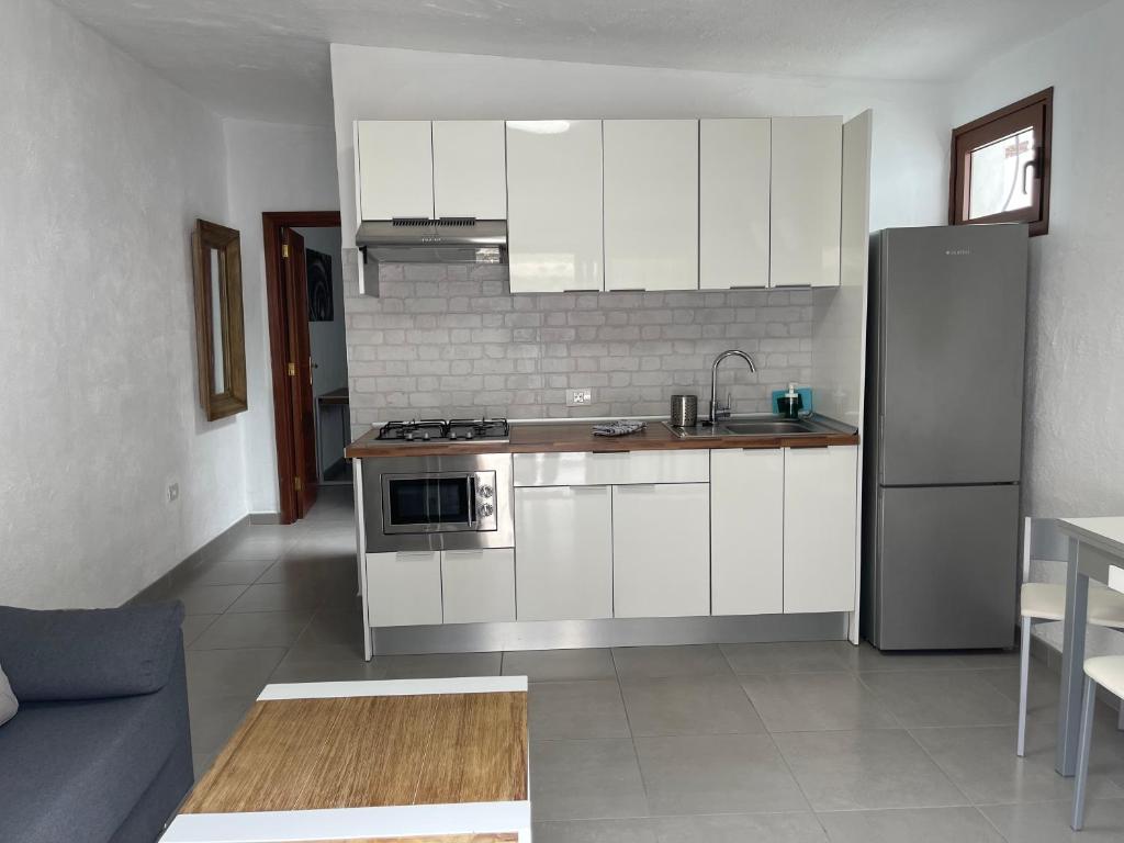 Kuchyň nebo kuchyňský kout v ubytování Apartamentos Finca Wapa