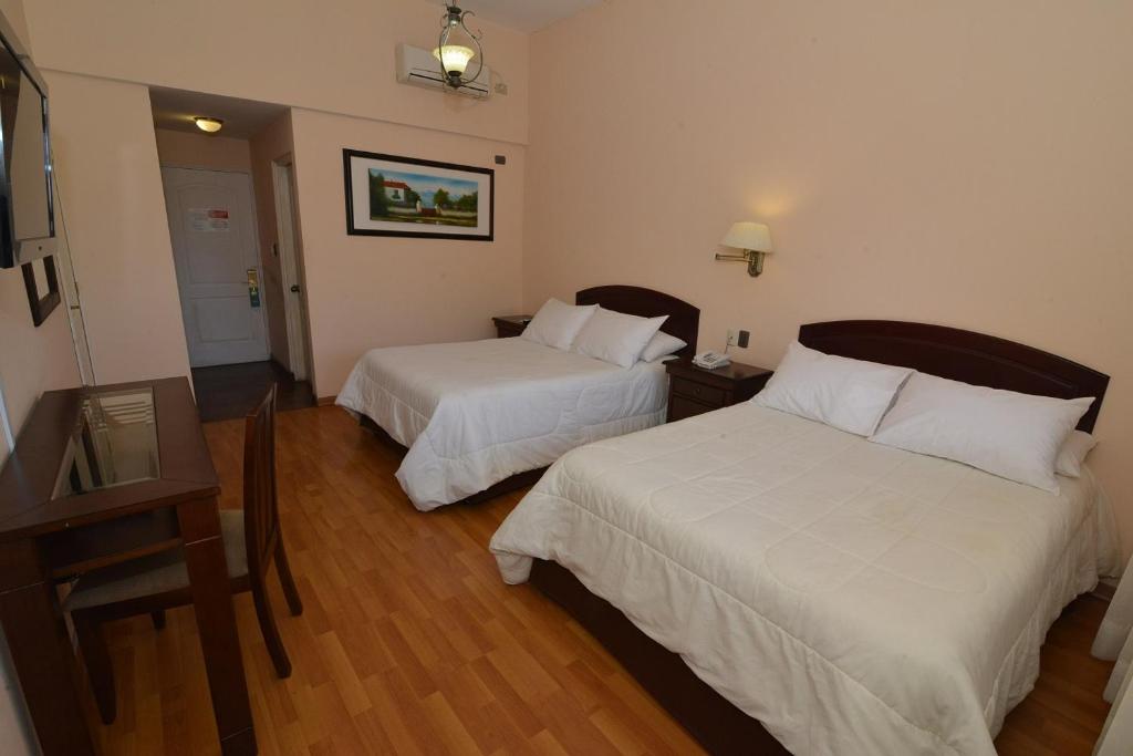 Postel nebo postele na pokoji v ubytování Howard Johnson Hotel Rinconada de Los Andes