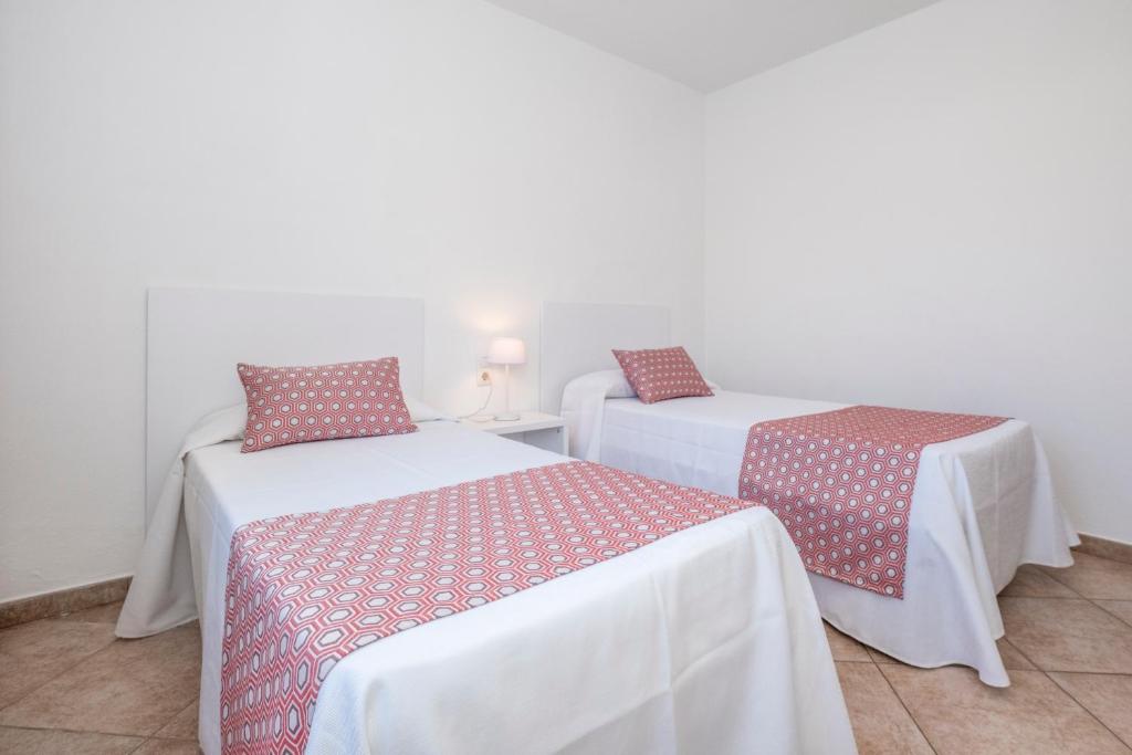 Postel nebo postele na pokoji v ubytování Villas Geisan