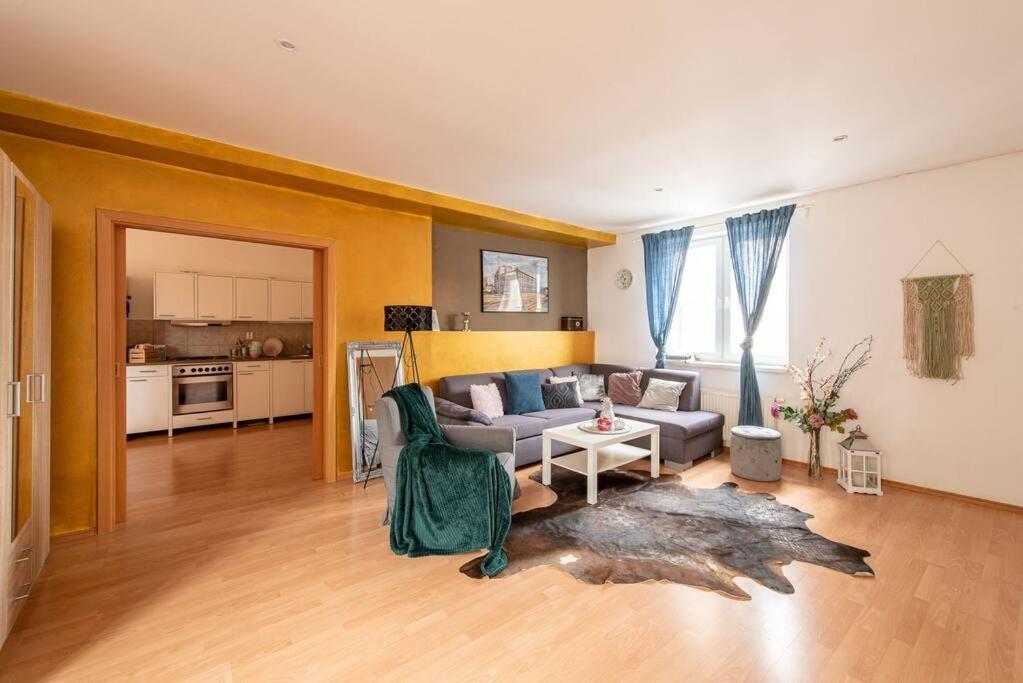 a living room with a couch and a table at Crystal view in Bratislava