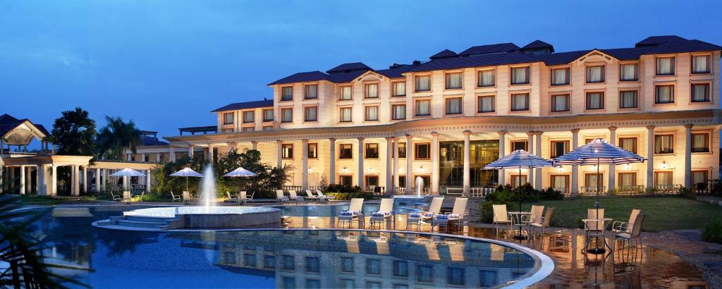 a hotel with a fountain in front of a building at Fortune Park Panchwati, Kolkata - Member ITC's Hotel Group in Kolkata