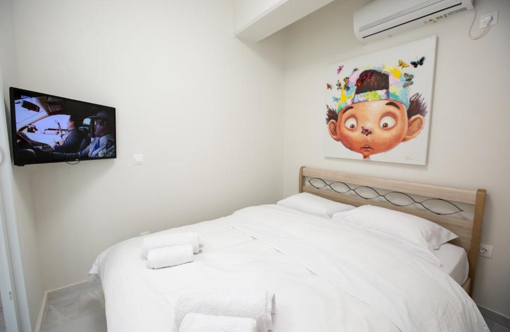 Postel nebo postele na pokoji v ubytování MELMA PROPERTIES - ARIA-Piraeus Central Penthouse