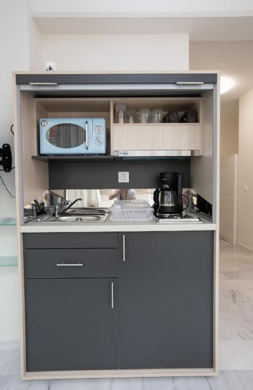 Kuchyň nebo kuchyňský kout v ubytování MELMA PROPERTIES - ARIA-Piraeus Central Penthouse