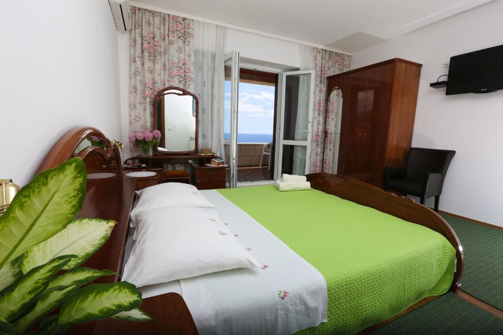 Posteľ alebo postele v izbe v ubytovaní Rooms Cvetka