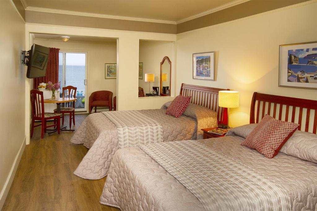 Postel nebo postele na pokoji v ubytování Hotel Motel Belle Plage