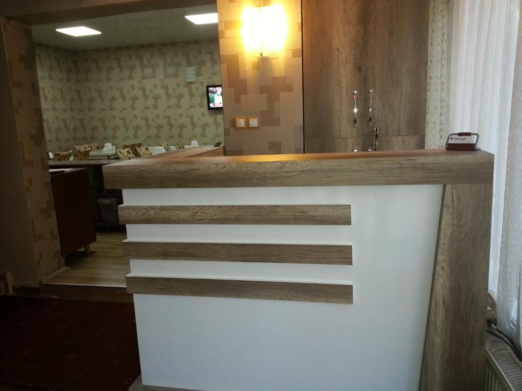 a counter in a bathroom with a sink at Hotel Kervansaray in Erzurum