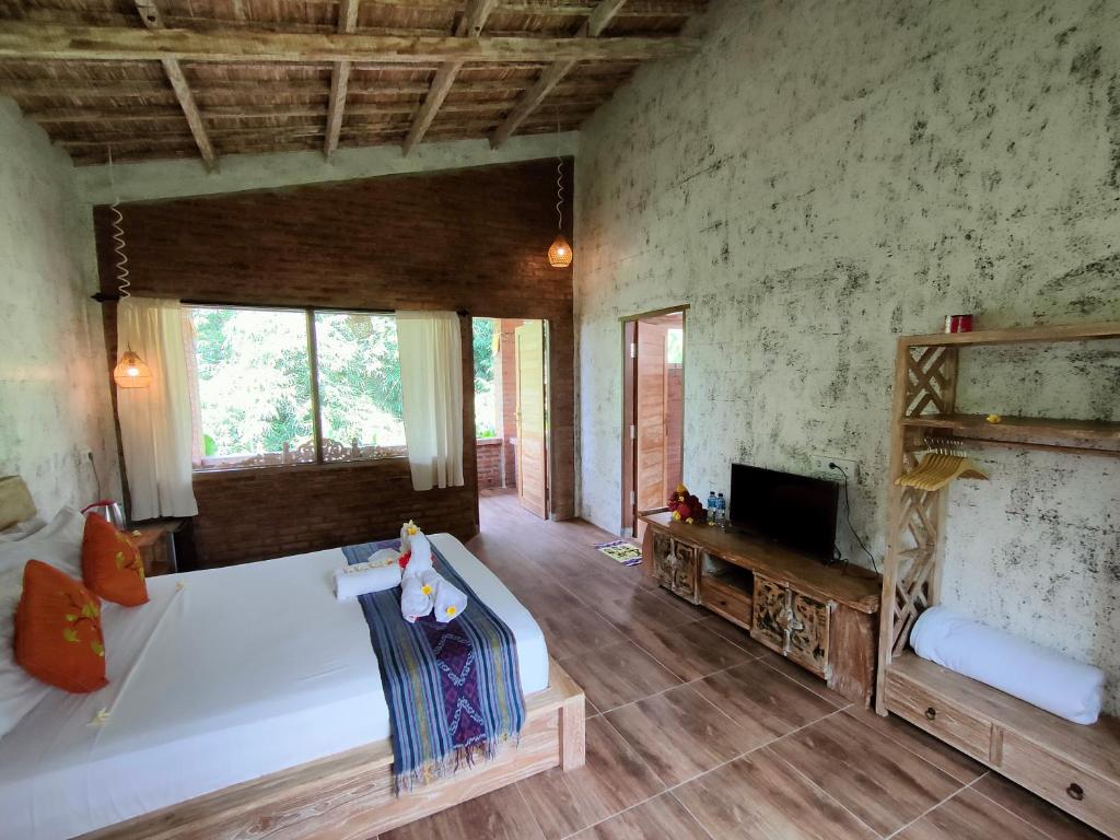 TV a/nebo společenská místnost v ubytování D'Nanda mini hotel Ubud
