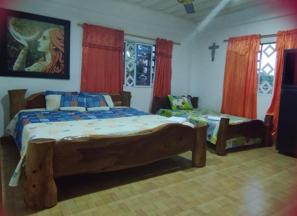 Ένα ή περισσότερα κρεβάτια σε δωμάτιο στο Casa campestre Doradal