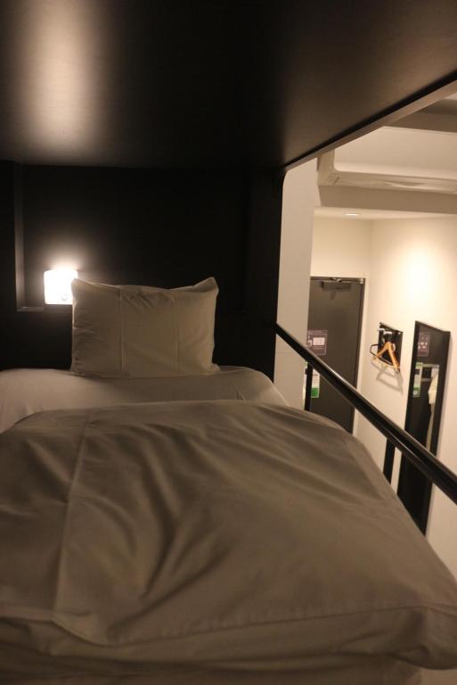 Postel nebo postele na pokoji v ubytování HOTEL TRAD Replay