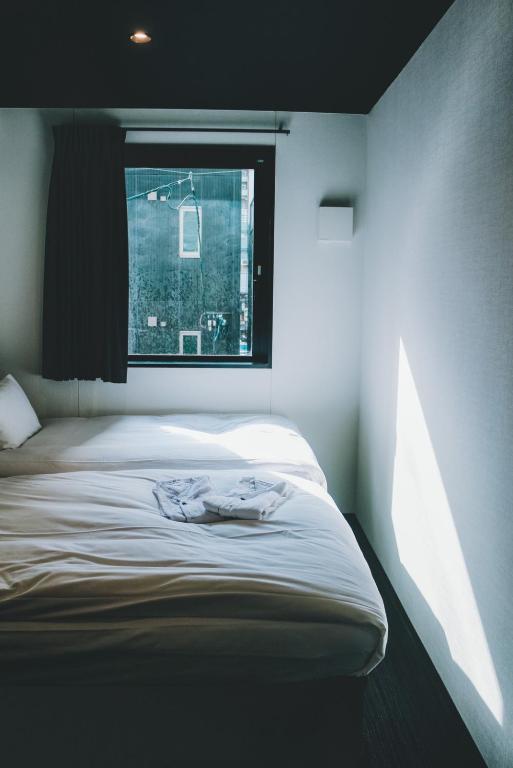 Postel nebo postele na pokoji v ubytování HOTEL TRAD Replay