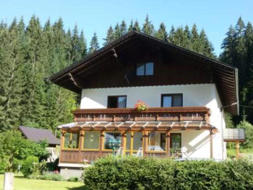 a house with a brown roof at Charming holiday home in Gosau in Gosau