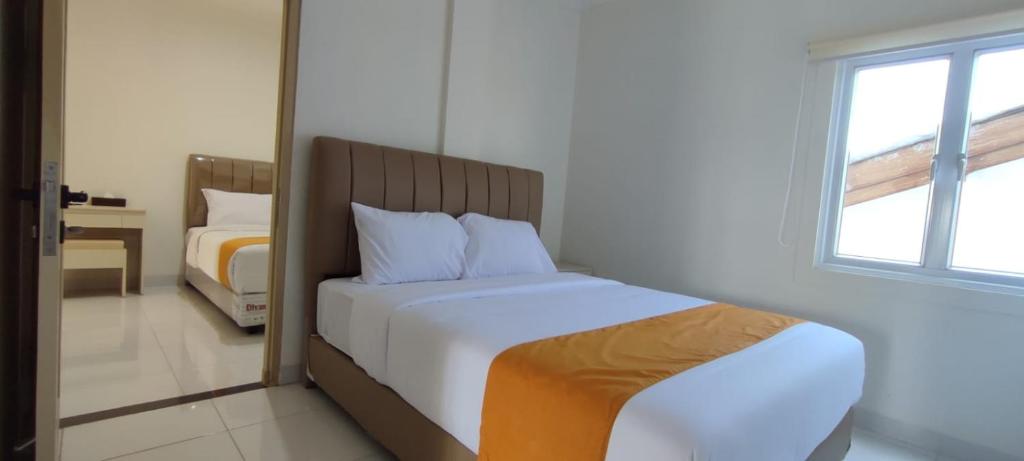 Postel nebo postele na pokoji v ubytování Batik Oma House