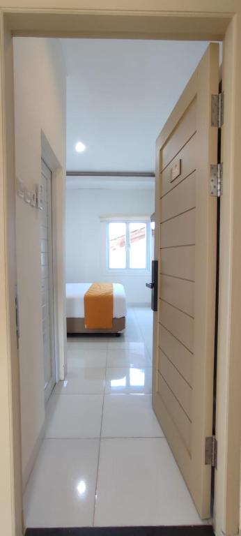 Postel nebo postele na pokoji v ubytování Batik Oma House