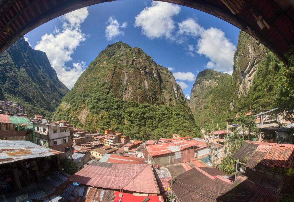 a view of a village with mountains in the background at ECO ART Best view Machu Picchu in Machu Picchu