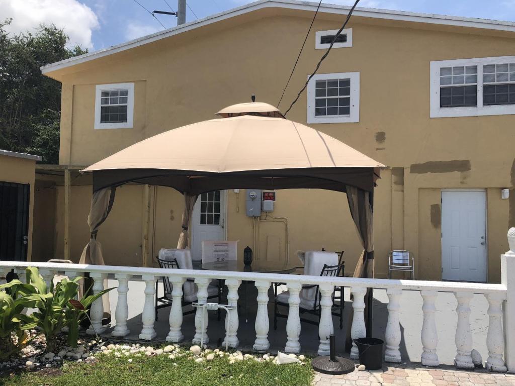 a large umbrella on the front of a house at Miami House in Miami