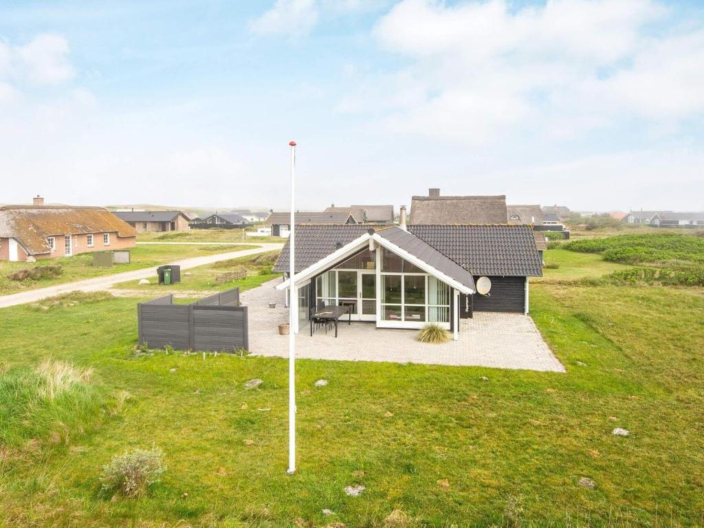 an aerial view of a house in a field at 7 person holiday home in Harbo re in Harboør