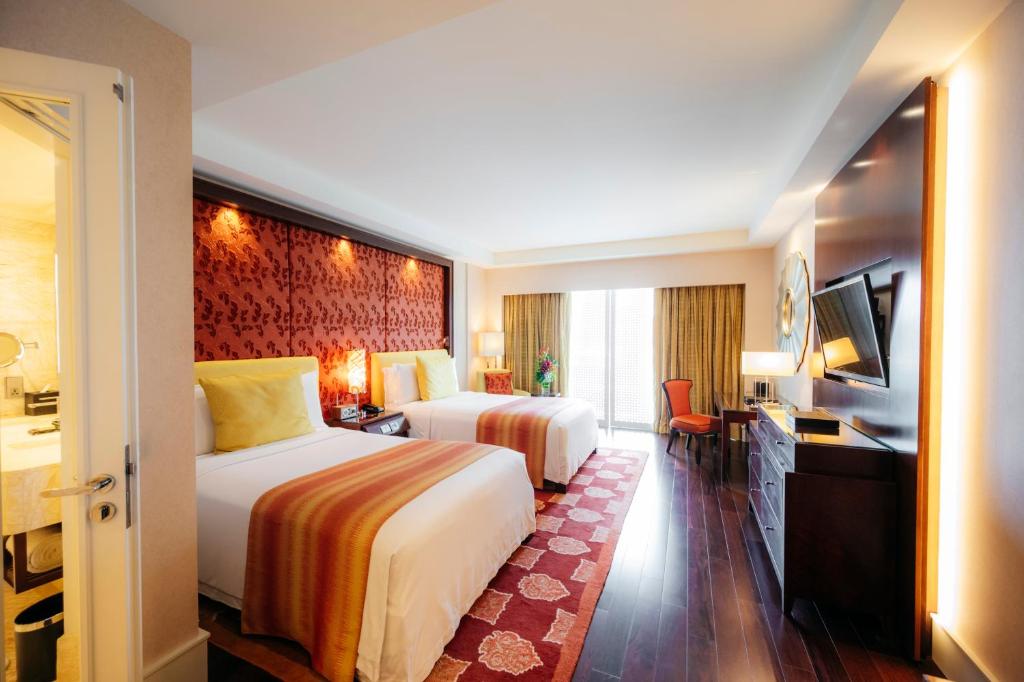 Postel nebo postele na pokoji v ubytování The Ritz - Carlton, Bangalore