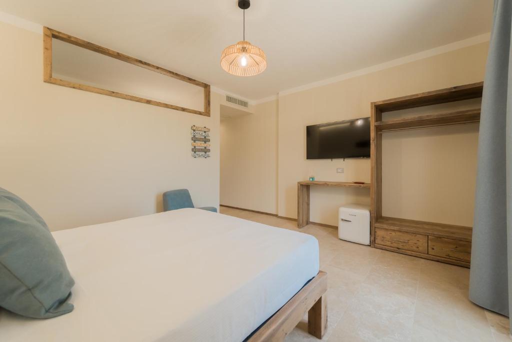 Voodi või voodid majutusasutuse BnB Il Grecale toas
