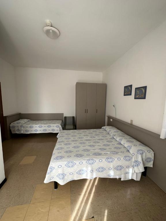 Postel nebo postele na pokoji v ubytování Hotel Reno