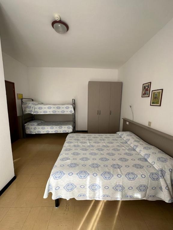 Postel nebo postele na pokoji v ubytování Hotel Reno