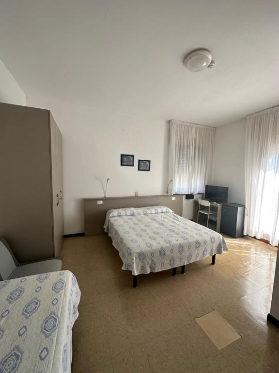 Postel nebo postele na pokoji v ubytování Hotel Reno