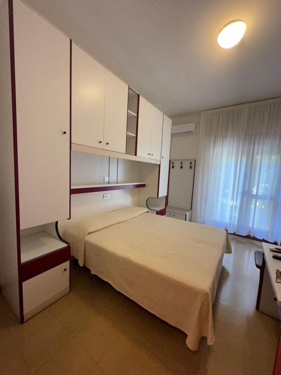 Postel nebo postele na pokoji v ubytování Hotel Reno